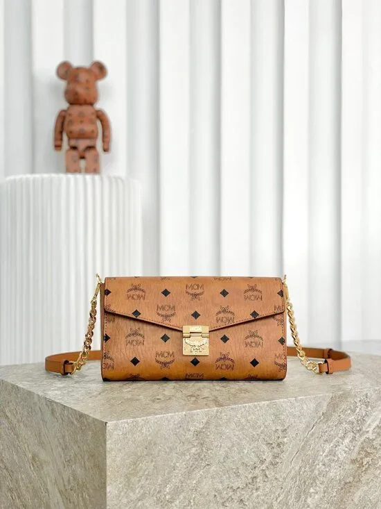 MCM Tan Monogram Clutch with Gold Accent - Picture 8 of 9